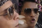 Bruno Mars wears gold sunglasses in the music video Uptown Funk