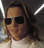 Johnny Depp, as George Jung, wearing the aluminium frame sunglasses in the movie
