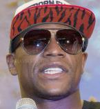 Floyd Mayweather, Jr wears a pair of Gucci 2887 sunglasses while talking to his 