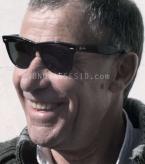 Robert Hill wears black Ray-Ban 2140 Wayfarer sunglasses in Down Terrace