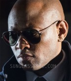 Omar Epps wears a pair of Ray-Ban RB4211 Aviator Light Ray II sunglasses in the TV series Shooter.