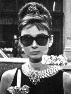 Audrey Hepburn wearing her famous Oliver Goldsmith sunglasses in the movie Break