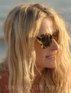 Mamie Gummer wears Tory Burch TY7201U sunglasses in the Amazon series We Were Liars.