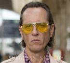 Richard E. Grant wearing "tinted Hunter S. Thompson-style glasses"