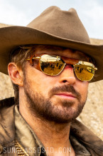Ryan Gosling wears gold American Optical Original Pilot sunglasses with leather side shields in The Fall Guy.