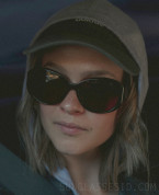 Clara Rugaard wears black oversized sunglasses in Season 6 of Black Mirror, episode Mazey Day (2023).