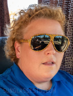 Fortune Feimster wears BluBlocker Original Aviator Leopard sunglasses in the series The Hawk.