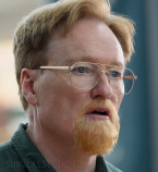 Conan O'Brien wears gold Capri Peachtree PT102 eyeglasses in Please Don't Destroy: The Treasure of Foggy Mountain.