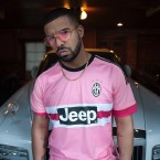 Drake wears a pair of vintage gold Cartier Romance Louis Cartier sunglasses with pink lenses with his Juventus soccer shirt.