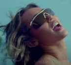 Miley Cyrus wears Chanel 9555 Shield sunglasses in the music video for Jaded (2023).