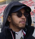 Lewis Hamilton wears Police Lewis 06 SPLA27 sunglasses.
