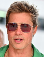 Brad Pitt wore Oliver Peoples Dresner OV1320 sunglasses during his fiming days at the British Grand Prix in July 2023.