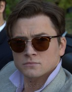 Taron Egerton wears vintage Persol sunglasses in Billionaire Boys Club.