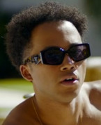 Raymond Cham Jr wears Prada SPR15Y sunglasses in The Idea Of You.
