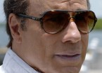 John Travolta wearing Ray-Ban Cats 5000 Classic RB4125 sunglasses in the movie Speed Kills.