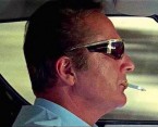 In the opening scene in The Italian Job (1969), the driver of the Lamborghini Miura, played by Rossano Brazzi, wears Renauld Mustang sunglasses.