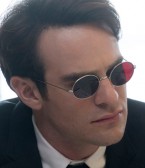 Charlie Cox as Matt Murdock / Daredevil wears a pair of custom round sunglasses with red lenses in Daredevil.