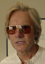 Josh Hamilton as Dr Carter wears vintage sunglasses in the movie Jay Kelly.