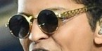 Bruno Mars wearing vintage gold Jean-Paul Gaultier sunglasses during Super Bowl 50