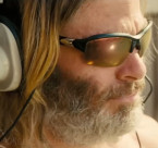 Chris Pine wears sports sunglasses in the comedy film Poolman (2024).