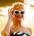 Margot Robbie wears white cat-eye sunglasses sunglasses in Barbie (2023).