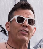 Steve-O wears a pair of matte white sunglasses in Jackass Forever.