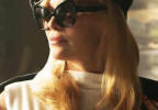 Pamela Anderson wears Dolce & Gabbana DG4463 sunglasses in this promo photo from the 2025 movie The Naked Gun.
