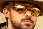 Ryan Gosling wears gold American Optical Original Pilot sunglasses with leather side shields in The Fall Guy.