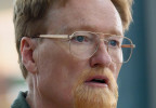 Conan O'Brien wears gold Capri Peachtree PT102 eyeglasses in Please Don't Destroy: The Treasure of Foggy Mountain.