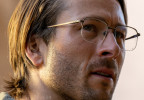 In one of his many disguises, Glen Powell wears Limited Editions Wolcott eyeglasses in the movie Hit Man.