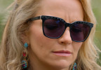 Becki Newton wears black sunglasses with crystals on the frame in Season 4 of The Lincoln Lawyer (2026).