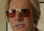 Josh Hamilton as Dr Carter wears vintage sunglasses in the movie Jay Kelly.