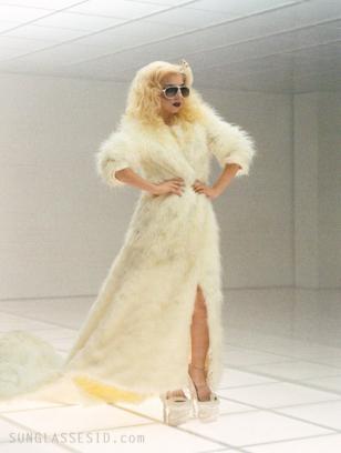 Lady Gaga, wearing white Carrera Champion sunglasses, presents her new video ‘Ba