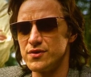 James McAvoy as Charles Xavier / Professor X wearing square rimless sunglasses in X-Men Apocalypse