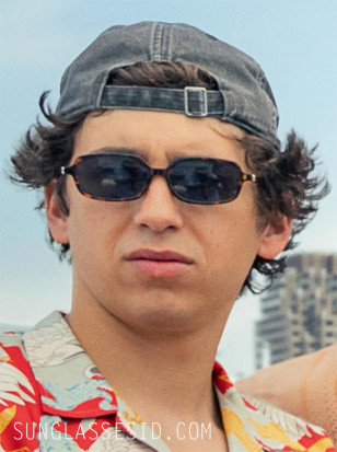 Marcello Hernández wears Miu Miu MU 11ZS sunglasses in the movie 72 Hours.