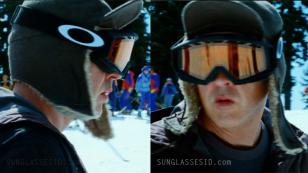 John Cusack wearing Oakley Proven Snow matte black snow goggles with Persimmon colored lenses