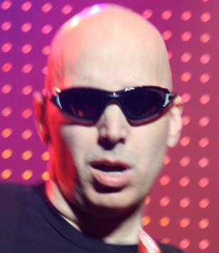 Joe Satriani wearing Oakley Straight Jacket (Jet Black, Emerald Iridium) on stag