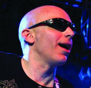 Joe Satriani wearing Oakley Straight Jacket (Jet Black, Emerald Iridium) on stag