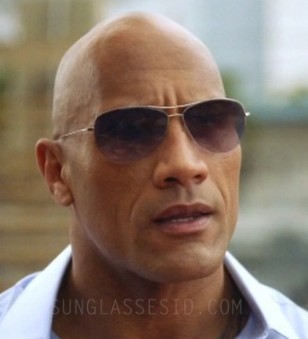 Dwayne Johnson (The Rock) wears Oliver Peoples Strummer sunglasses in Season 1, Episode 2 of the HBO tv series Ballers.