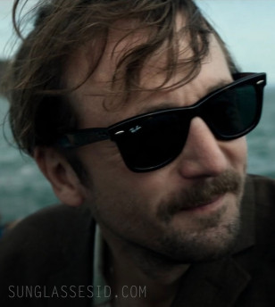 Tom Basden wears a pair of Ray-Ban 2140 Wayfarer sunglasses in The Ballad of Wallis Island.