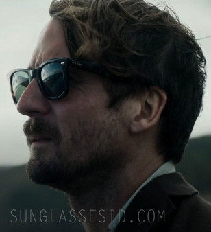 Tom Basden wears Ray-Ban 2140 Wayfarer in The Ballad of Wallis Island.