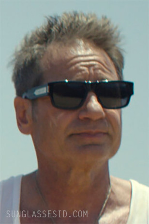 David Duchovny wears black Saint Laurent SL659 sunglasses in Malice.