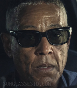 Giancarlo Esposito wears black wayfarer style sunglasses in Parish.