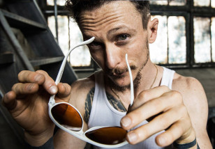 Jonathan Tucker as Jay Kulina wears white BluBlocker Original Aviator sunglasses in the series Kingdom (2014).