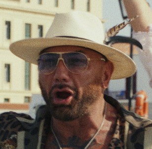 Dave Bautista wears Carrera CA1005-S oversized classic pilot sunglasses in the movie Glass Onion: A Knives Out Mystery.