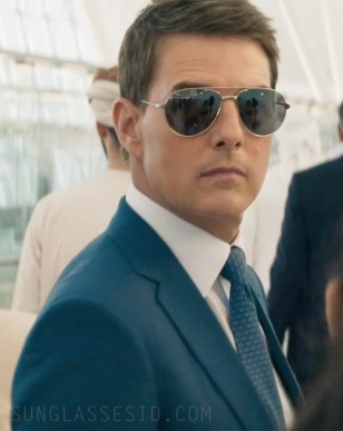 Tom Cruise wears Cartier CT0038S Santos de Cartier sunglasses in Mission: Impossible - Dead Reckoning Part One. Note that the leather piece is removed on these glasses.