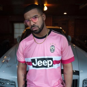Drake wears a pair of vintage gold Cartier Romance Louis Cartier sunglasses with pink lenses with his Juventus soccer shirt.