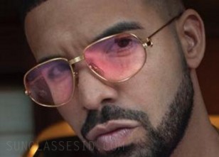Drake wearing the solid gold Cartier Romance Louis Cartier sunglasses with pink lenses