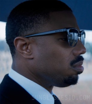 Michael B. Jordan wears a pair of black Coach HC8326 C6194 Signature Workmark Retro Frame sunglasses in Creed III.