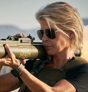Linda Hamilton as Sarah Connor wears Dolce & Gabbana DG2166 sunglasses and a Nixon watch in Terminator 6: Dark Fate (2019).